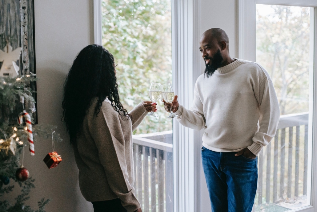 A husband and wife toast to closing on their home using an FHA loan with the new loan limits just in time for the holidays.