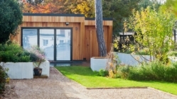 A modern ADU set in small backyard garden